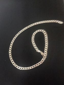 Polished 925 Sterling Silver Overlay curb link chain necklace. This piece has a lobster claw clasp and a flat link design.