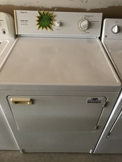 A white front load Magic Chef dryer