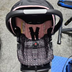 CAR SEAT -  EVENFLO,  BLACK AND PINK