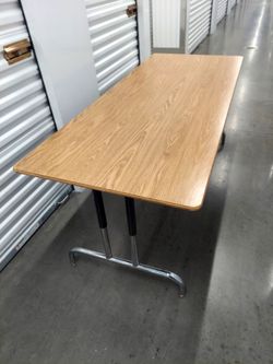 Great quality, Adjustable Height Office table. Excellent Condition, 72" X 30" X Adjustable height. Have Two.