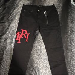 Amiri Black Jeans with Red Logo