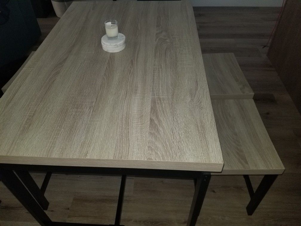 Rubberwood and black metal dining table
