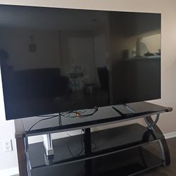 3 Tier GLASS ENTERTAINMENT CENTER WITH 65 IN ROKU TV