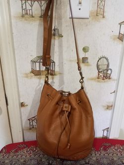 KELSI DAGGER PEBBLE LEATHER CROSSBODY BUCKET BAG COGNAC BAG. for Sale in Sugar Land TX OfferUp