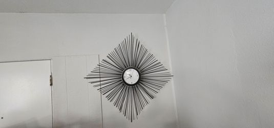 Modern Black Metal Sunburst Wall Clock