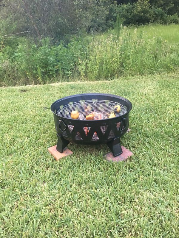 Outdoor Fire Pit used once with the Cover and Grill. for Sale in Tampa