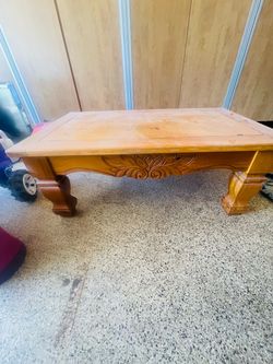 Ashley Furniture traditional carved-wood coffee table.