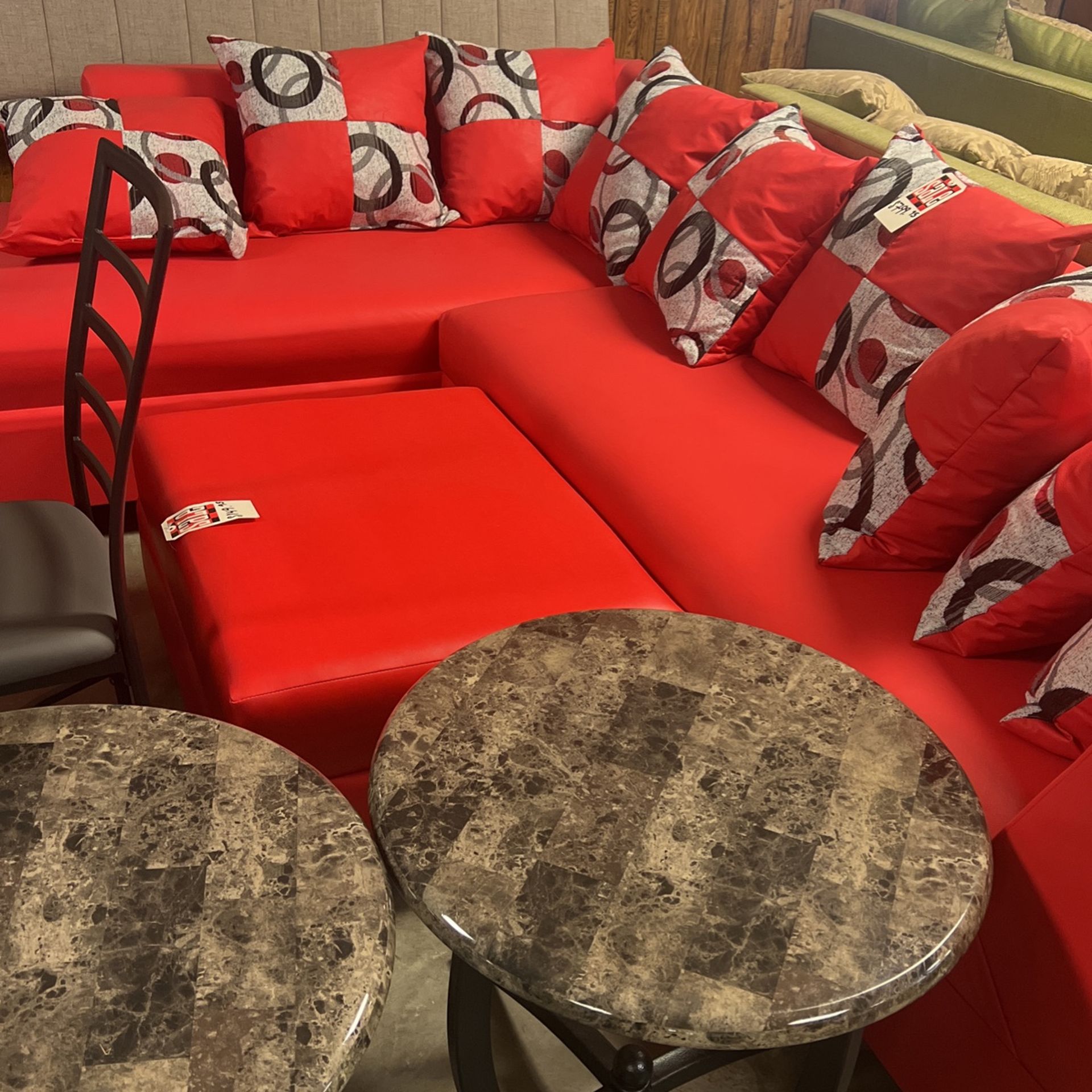 Red sectional and cocktail ottoman for $1000. Brand new