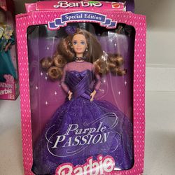 Mattel Special Edition Purple Passion Barbie doll, released in 1995.  The doll has auburn hair and blue eyes.  It is a fashion doll wearing a shimmeri