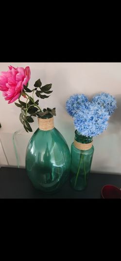 2 green glass vases