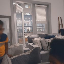 Grey Loveseat And Couch With Pillows 