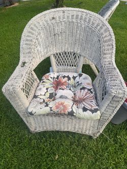 2 wicker chairs with cushions