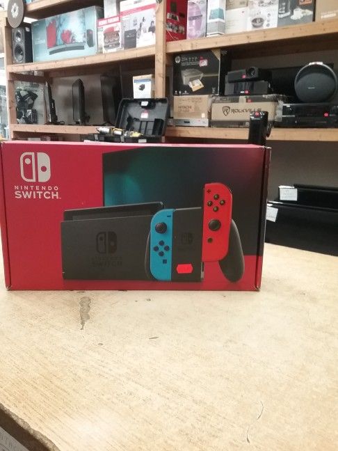 Nintendo Switch with Neon Blue and Neon Red Joy‑Con ............