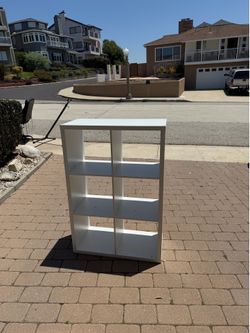 Small white shelving/cubbies