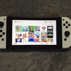 NINTENDO SWITCH with 12& GAMES MARIO KART,MARIO PARTY,POKEMON,MINECRAFT,ZELDA