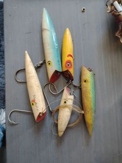 5 vintage fishing lures I looked them up on Google I can't figure out what exactly they are