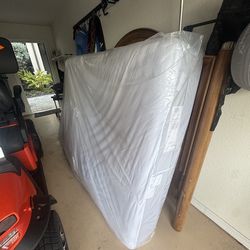 Queen mattress with tick cover.