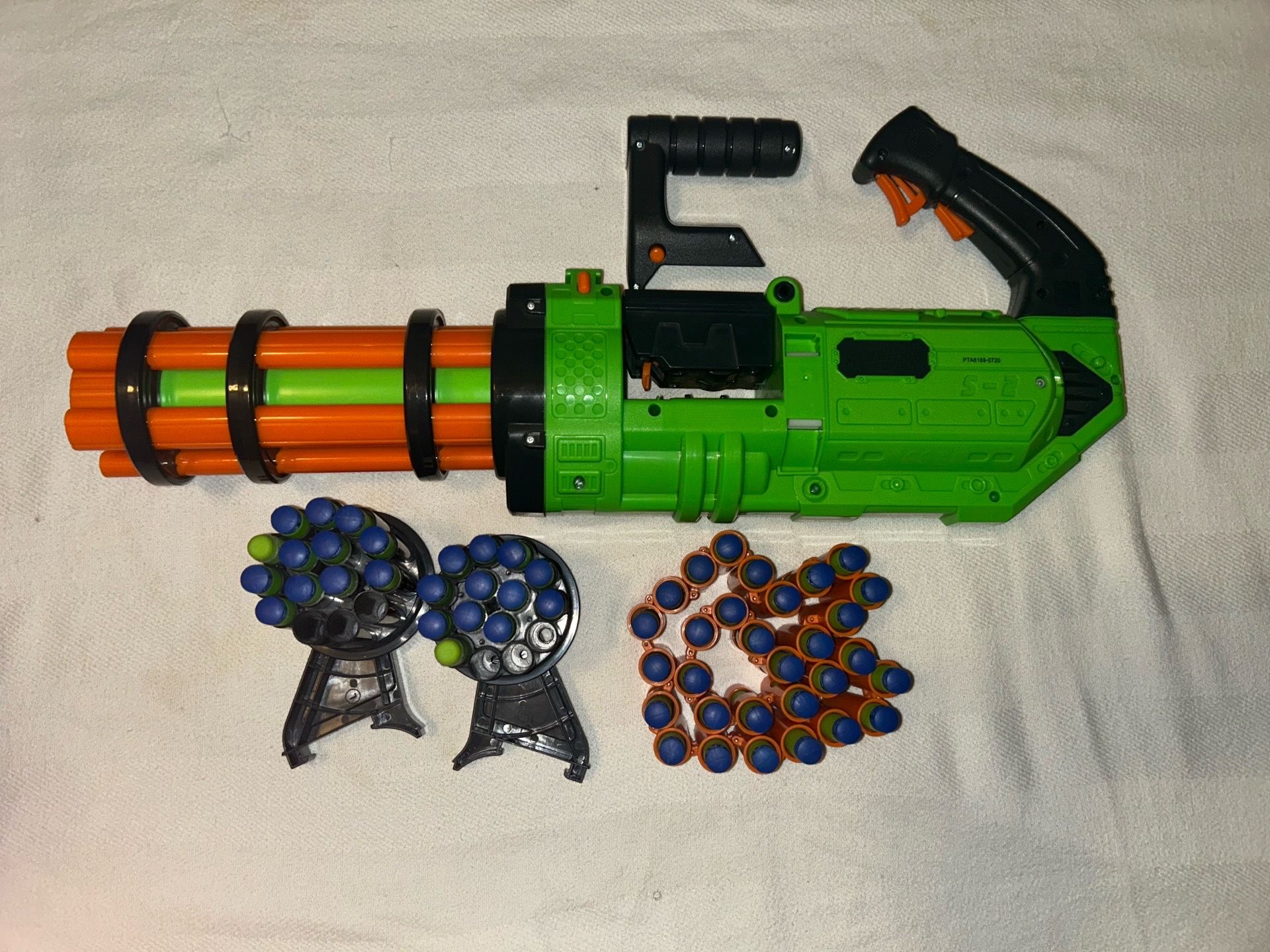 Adventure Force V-Twin Motorized Gatling Belt Blaster in green and orange.