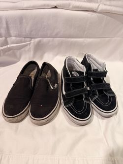 Two Pairs of Black Vans Sneakers