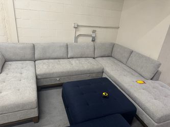 Large grey sectional with storage