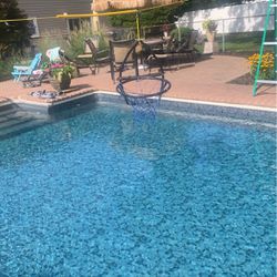 Basketball Hoop Hanging Over Pool