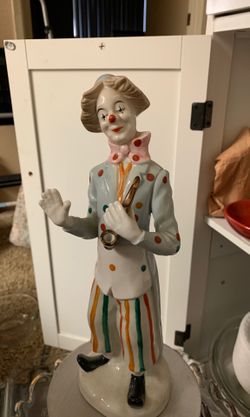 Porcelain clown with saxophone