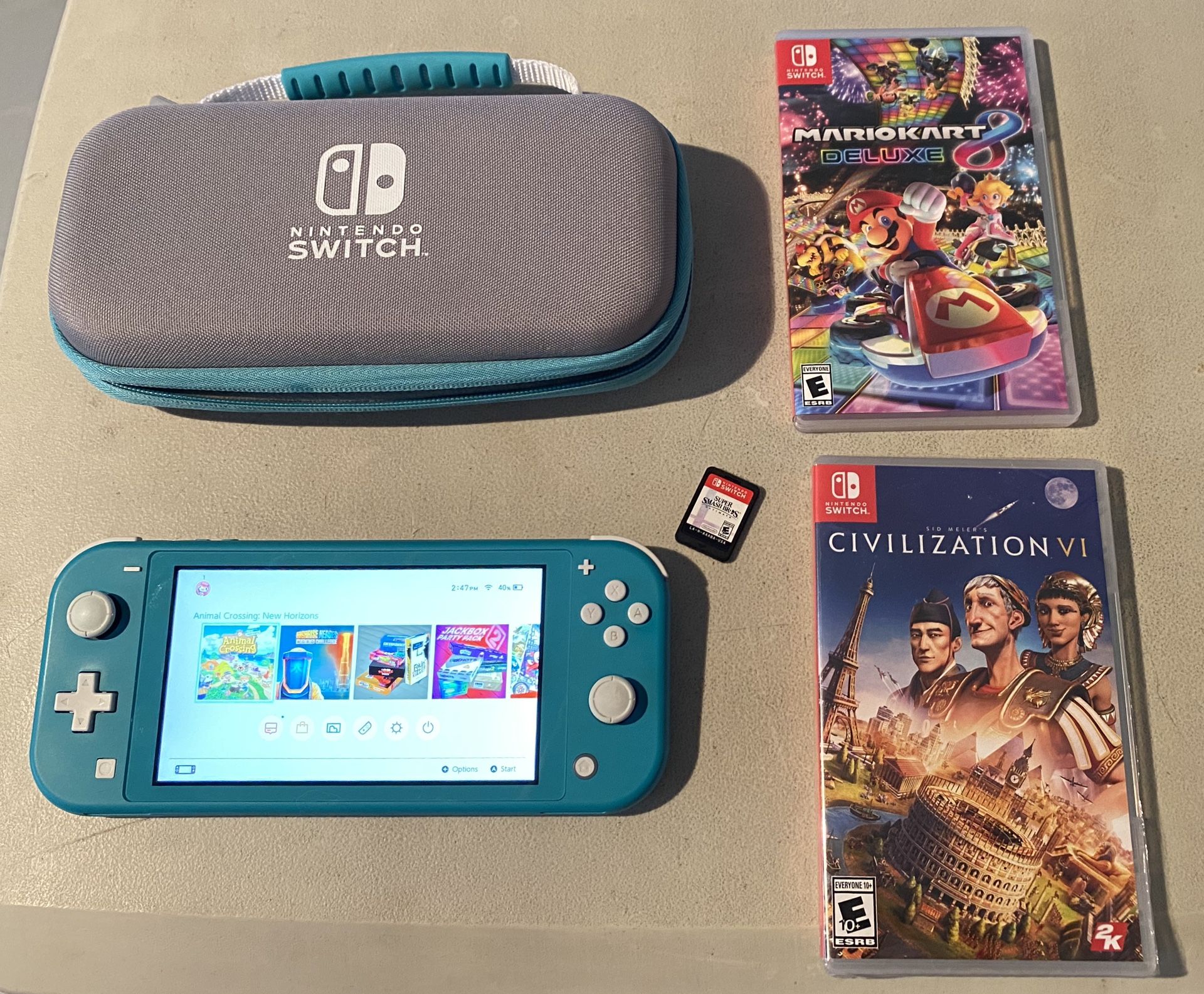 Nintendo Switch Lite Turquoise with case and 3 games