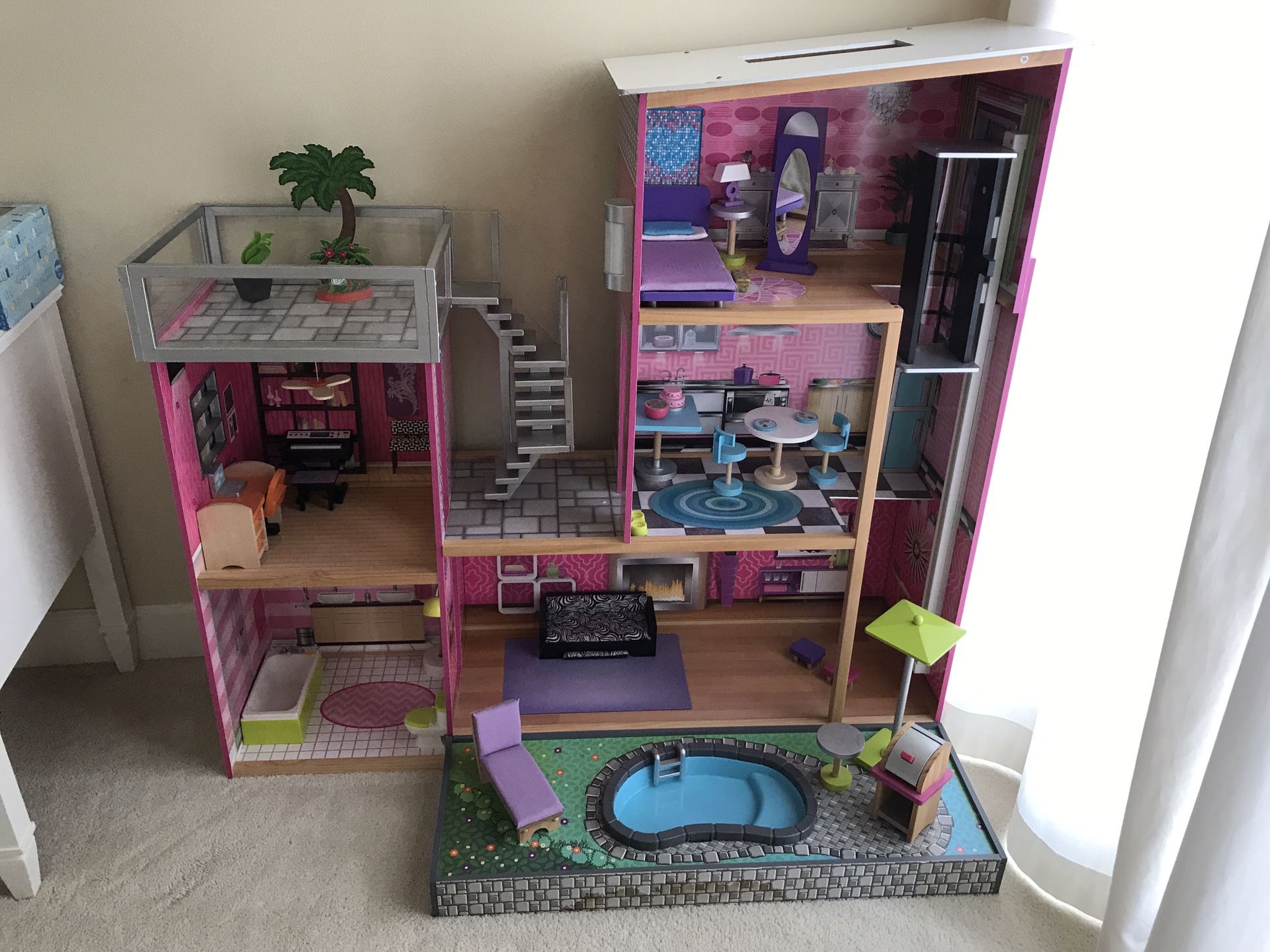 Uptown’s Doll House by KidKraft in Perfect Condition 4ft wide and 46” inch (almost 4 ft) tall includes all accessories