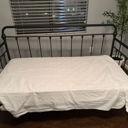 Living Spaces Twin Bed/couch. Beautiful Iron Piece.