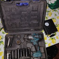 Impact wrench with two batteries, charger, and several sockets shown in the picture. Only serious inquiries, please. Thank you. 