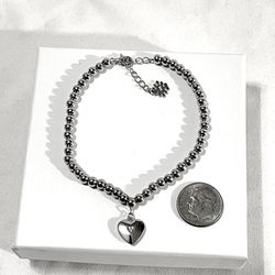Brand New .925 Silver 7-1/2” bead, strand bracelet with silver heart pendant