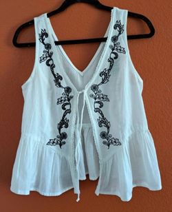 White Embroidered Sleeveless Peplum Top