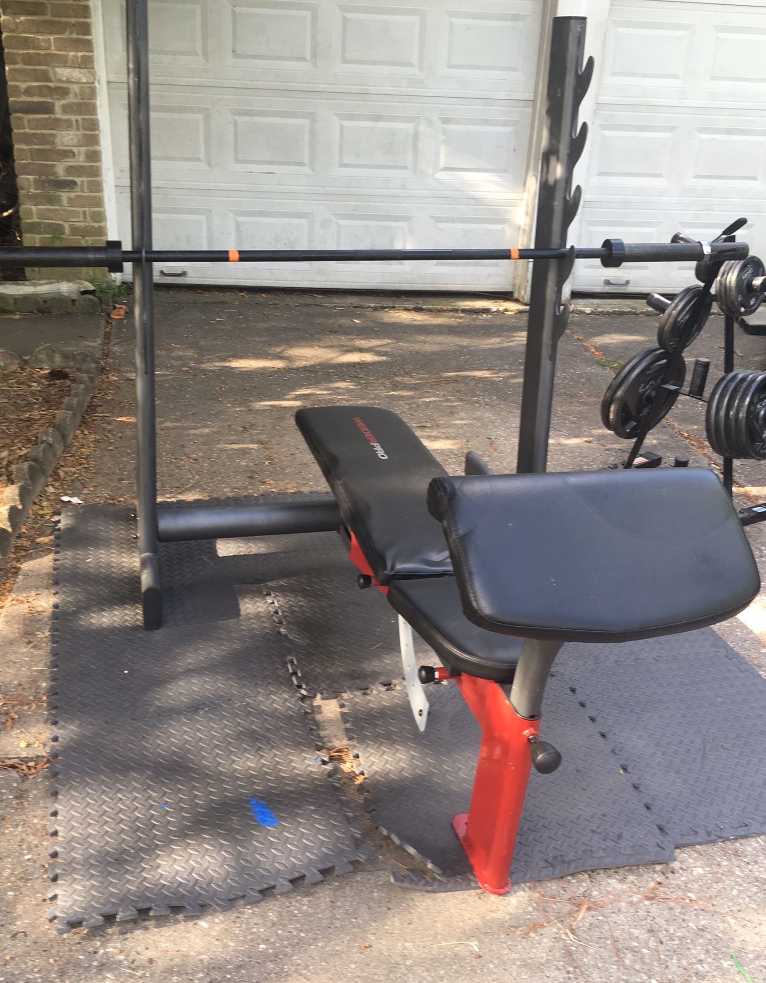 Olympic weight bench,Olympic bar, curl pad-250 lbs of weight+tree+mats