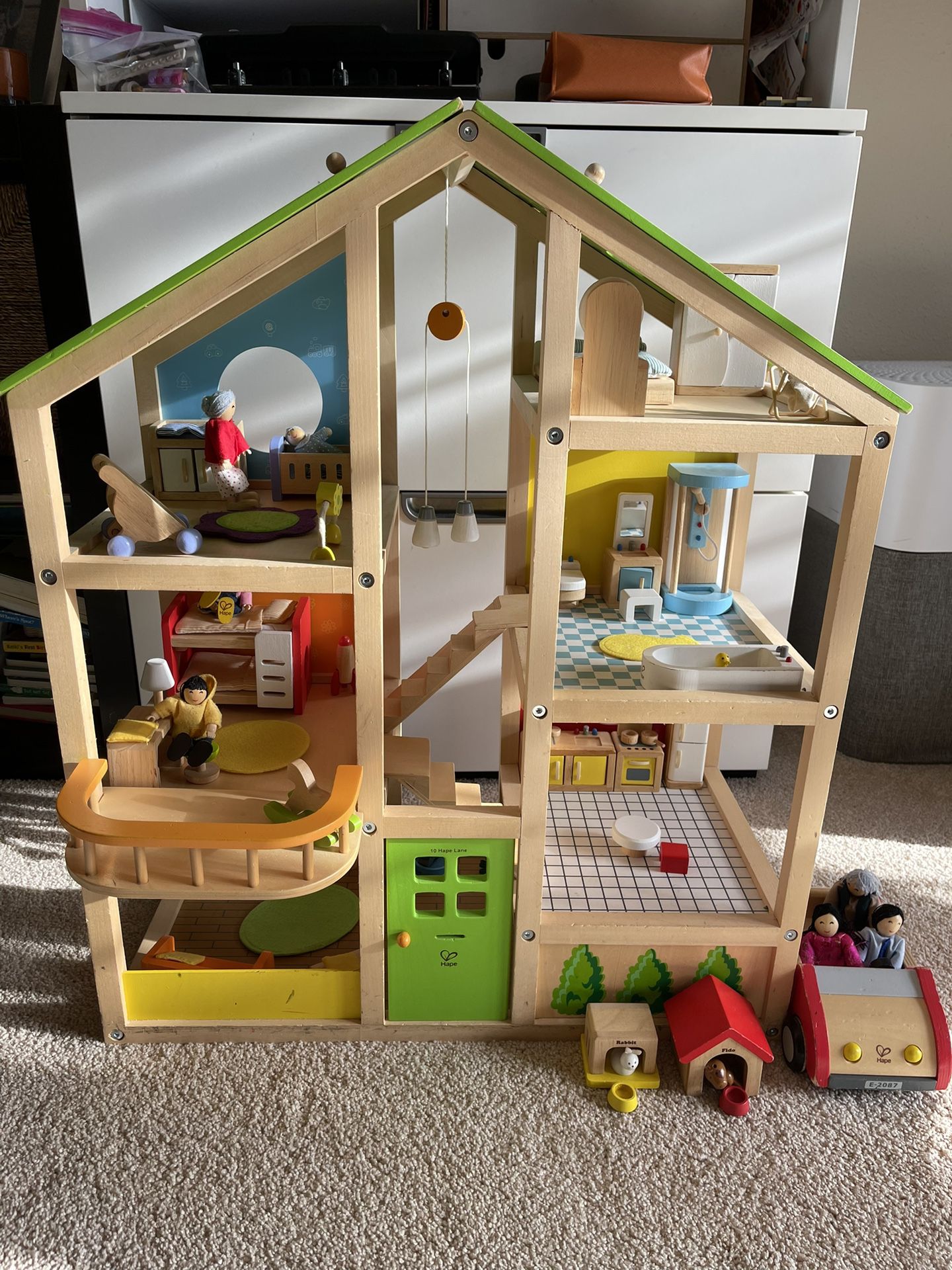 Hape wooden dollhouse and furniture