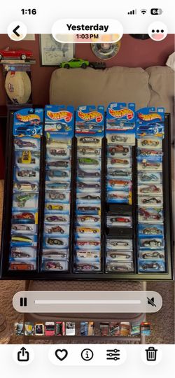 65. Classic Hot Wheels with display board.