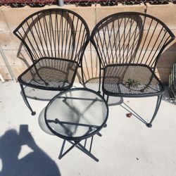 Wrought Iron chairs and glass table (Location In Description)