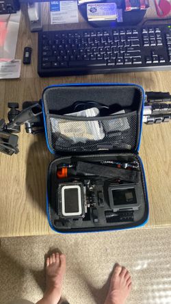 Go Pro camera with case tripod and extras