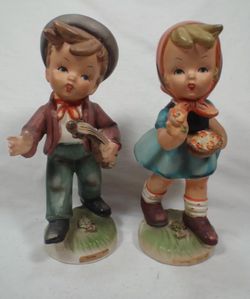 Porcelain Boy & Girl Figurines designed by Erich Stauffer