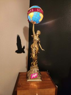 Iconic Vintage Schlitz Lady Holding Globe Statue