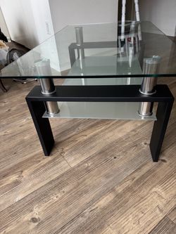 A beautiful modern two tiers glass coffee table used as new.