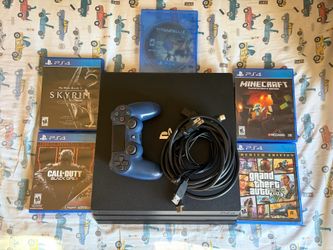 Ps4 pro with 5 games and controller