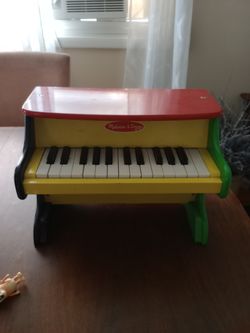 Melissa and Doug upright piano