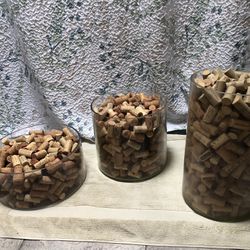 3 Glass Cylinders Full Of Corks