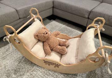 Wooden arch and rocker with cushion