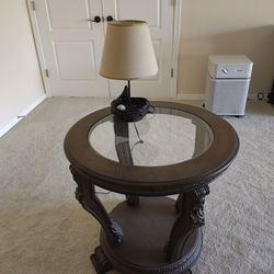 Elegant Round End Table with Glass Top & Carved Wood Details