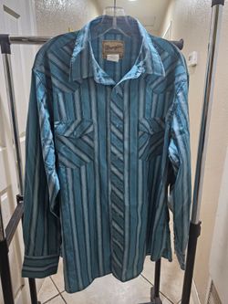 Wrangler men's turquoise and blue striped long-sleeve western shirt featuring classic pearl snap buttons