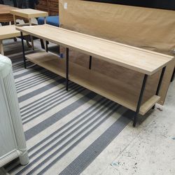 Low, long TV stand. Has shell for other components. Entertainment center