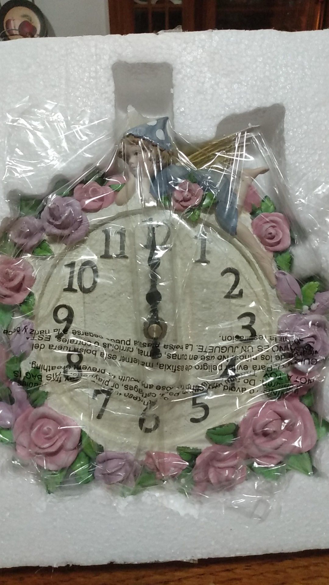 A pink fairy ceramic wall clock