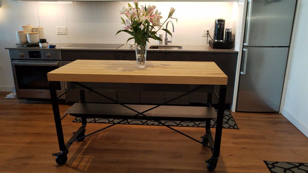 Farmhouse table kitchen island on rollers.