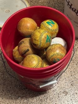 Bucket of 23 softballs